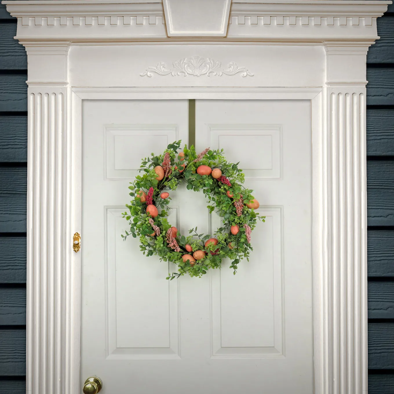 22 in. Easter Wreath Decorated with Pink Pastel Eggs, Pink Flowers, Leafy Greens