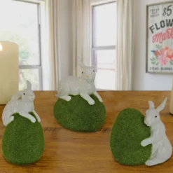 7 in. White Easter Rabbit Figures on Green Moss Covered Eggs, Set of 3